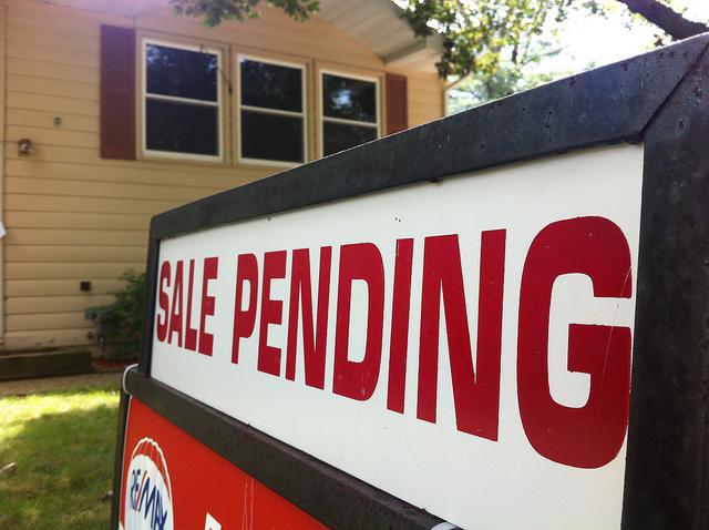 Sale pending sign outside house