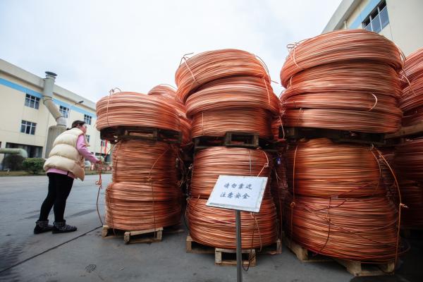 Bales of copper wires are stacked inside the workshop of the Large Copper Manufacturing Company