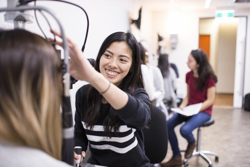Female orthoptics student assessing a patient.
