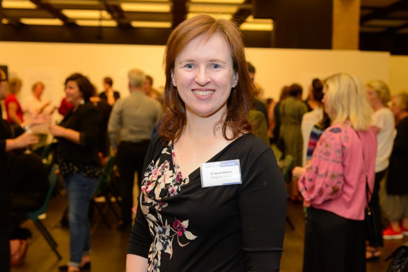 Naomi Malone posing and smiling while at her 'Access leads to inclusion' exhibition launch.