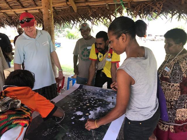 An image of stakeholders depicting the local ecosystem services in their area.