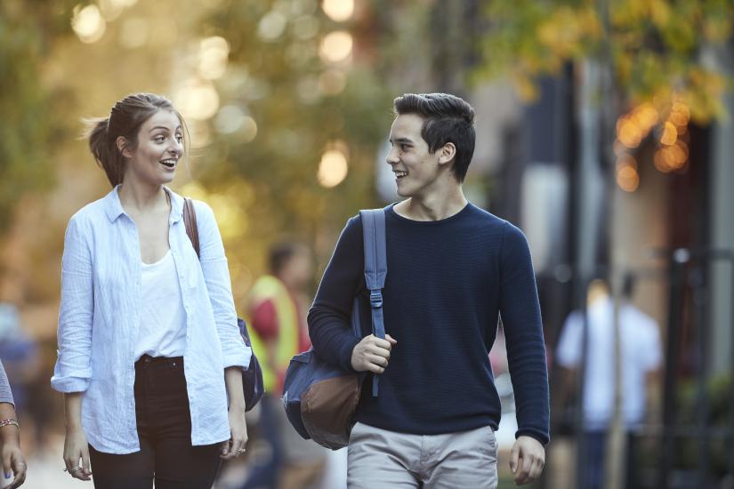 Two students walk together