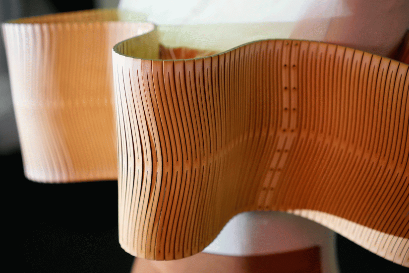 Detail of laser-cut wooden fashion textile on a mannequin