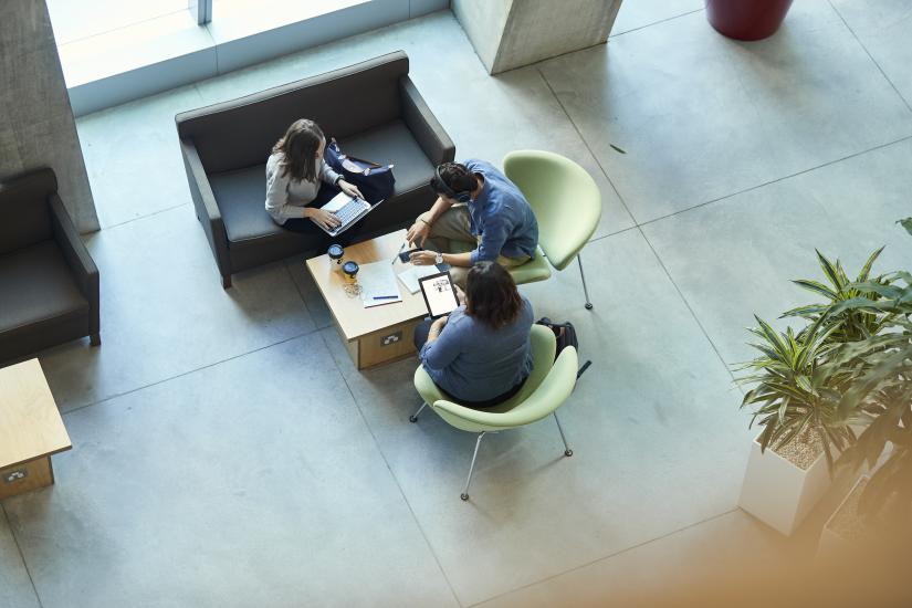 Top aerial view of three students