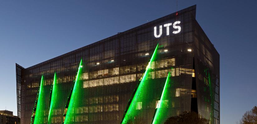 Illuminated FEIT building at night