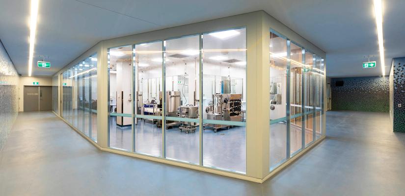 View of the glass-walled Biologics Innovation Facility from the perimeter corridor