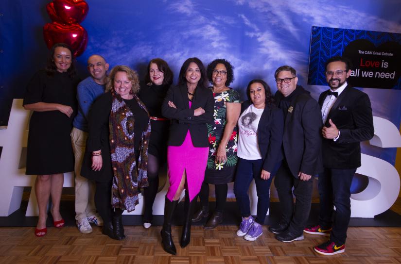 The UTS FASS CAIK Great Debaters standing against the sky backdrop