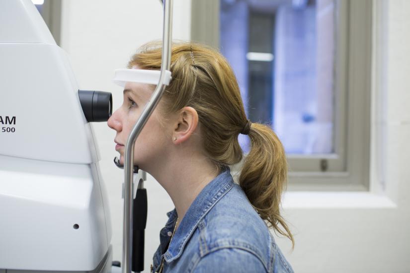 Image of woman undertaking eye test