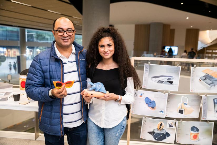 U@Uni Academy student showcasing her work to her dad.