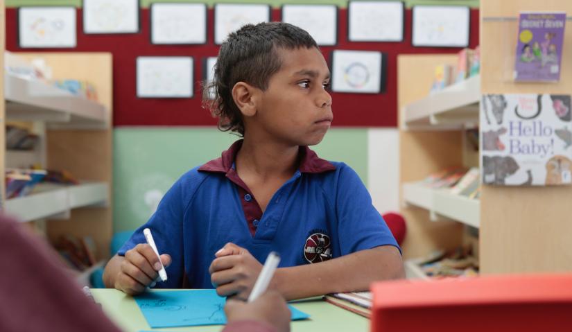 Dujuan Hoosan sitting at his school desk