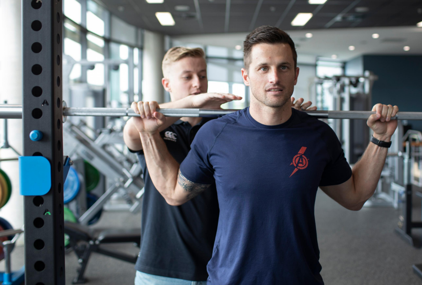 Adam Trama, UTS Sport and Exercise Student, with instructor in the Resistance Training Room at UTS Moore Park