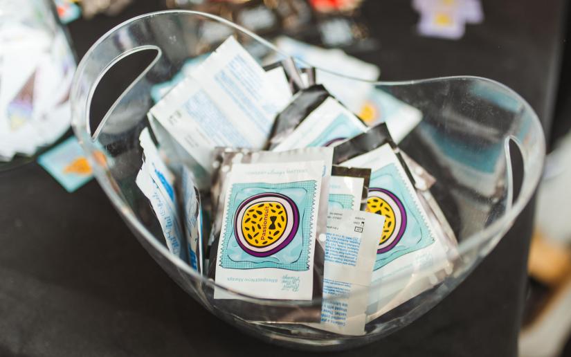 A bowl of condoms brandishing Respect.Now.Always messaging.