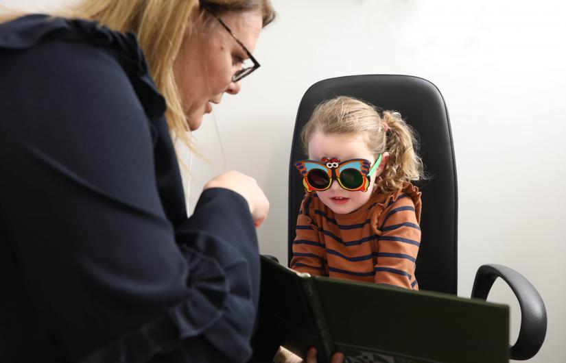 young girl getting eye test
