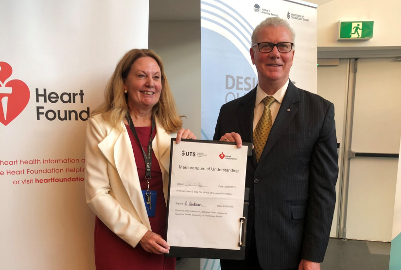 Professor Debra Anderson signing Heart Foundation agreement