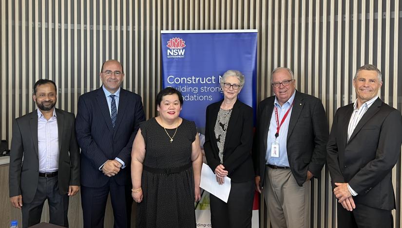 Six people attending the CIDP launch smile at the camera