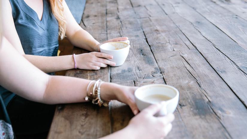 two people drinking coffee