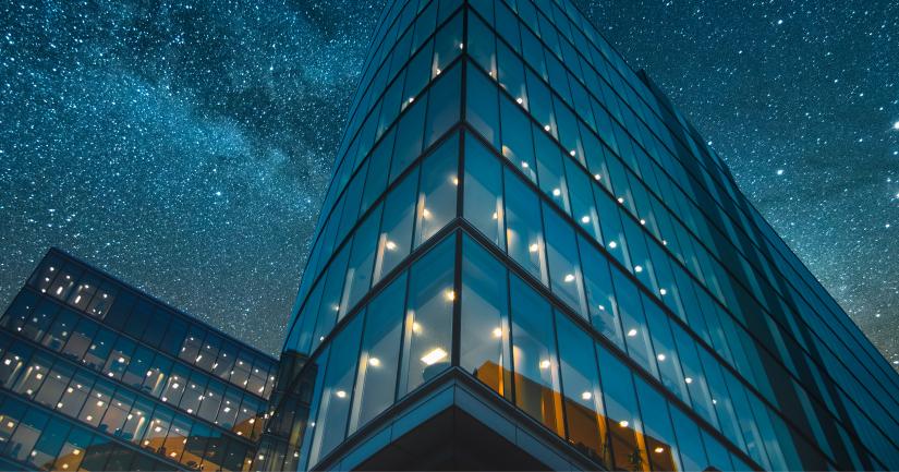 Building with starry night light background.