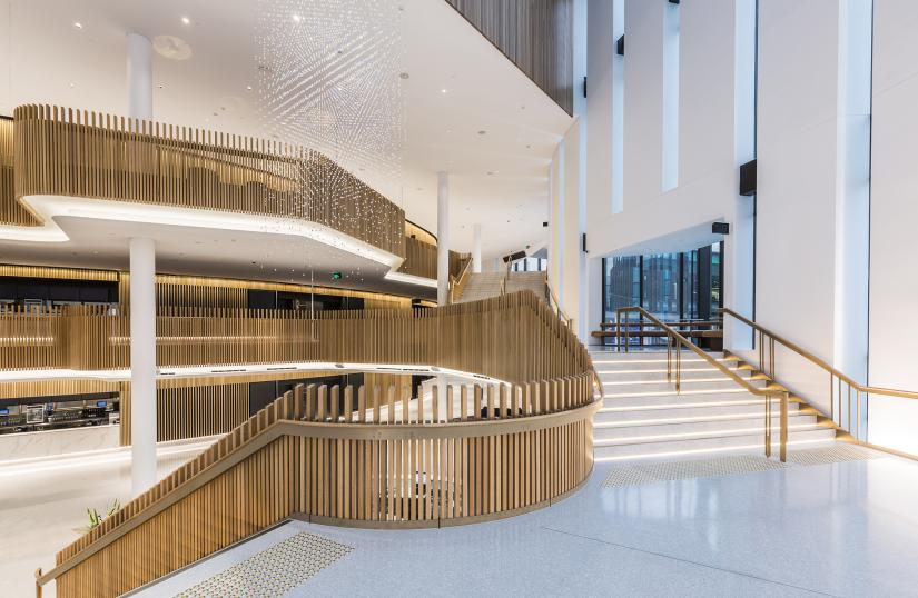 Large foyer and stairwell, white with wooden features