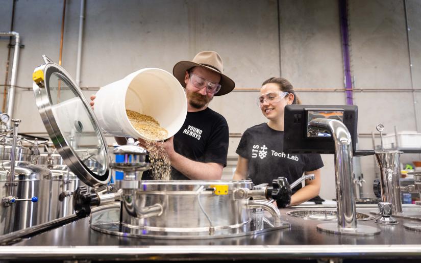 Young Henrys Head Brewer Jesse Searls works with PhD student Laryssa Raffa in the UTS Industry 4.0 Brewery