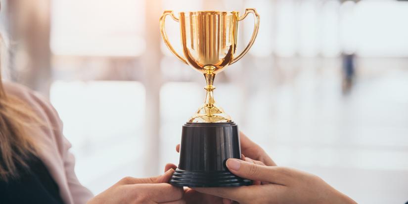 Champion golden trophy for winner background. Success and achievement concept.