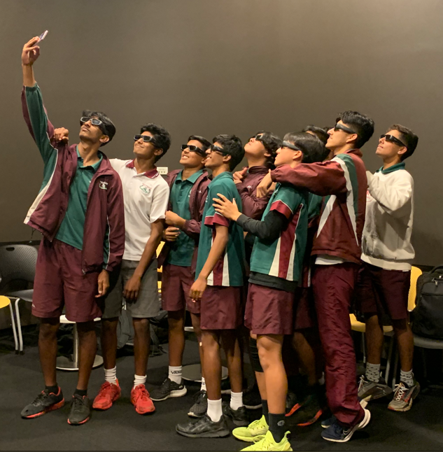 a group of Macquarie Fields High School students wearing 3D glasses about to enter the UTS Data Arena.