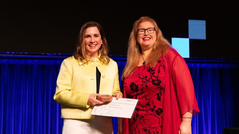 Sally Inglis receives the UTS Medal for Research Impact from Professor Kate McGrath