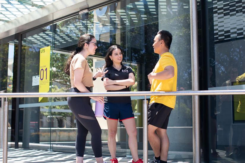 3 students talking outside Moore Park campus