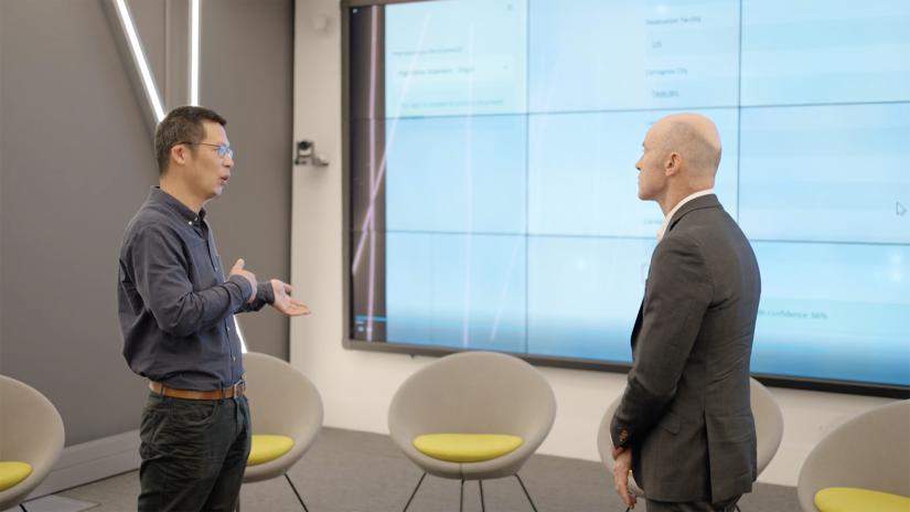 Two presenters engaging on the topic of data driven artificial intelligence