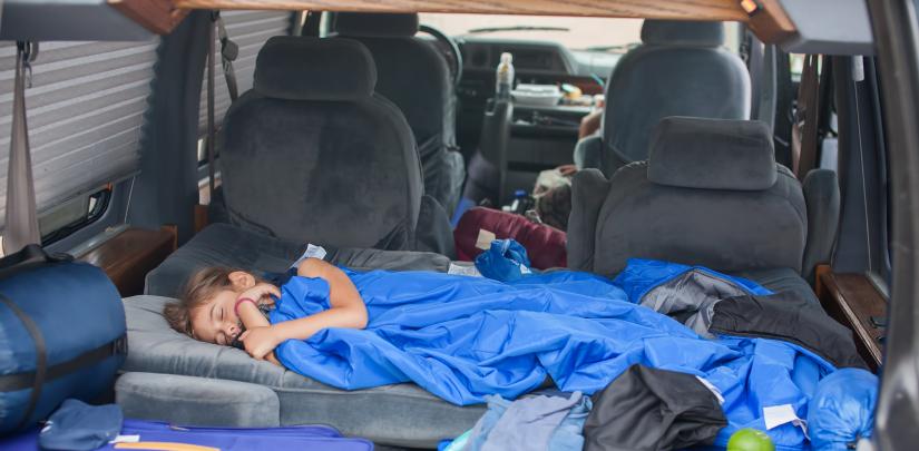 girl sleeping in a car