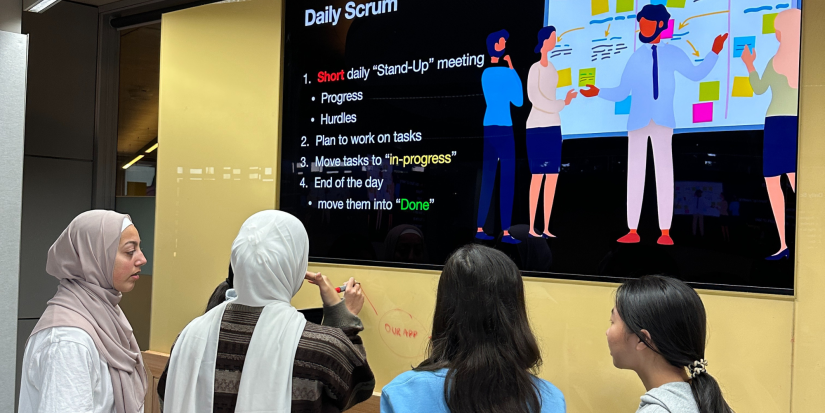 Students at scrum meeting