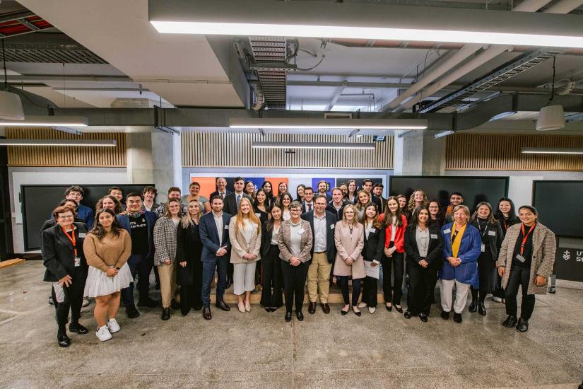 Large group of participants pose at the Law Tech Challenge