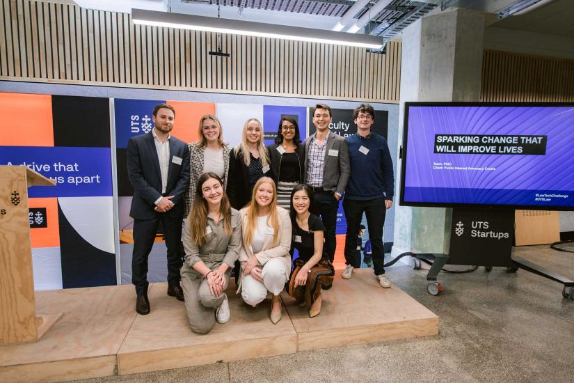 Team PIAC pose on stage