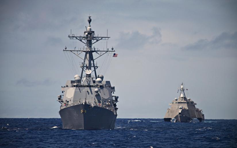 A USS Destroyer and Littoral Combat Ship hunt together in the South Pacific. Taken during a Pacific Deployment in 2014.