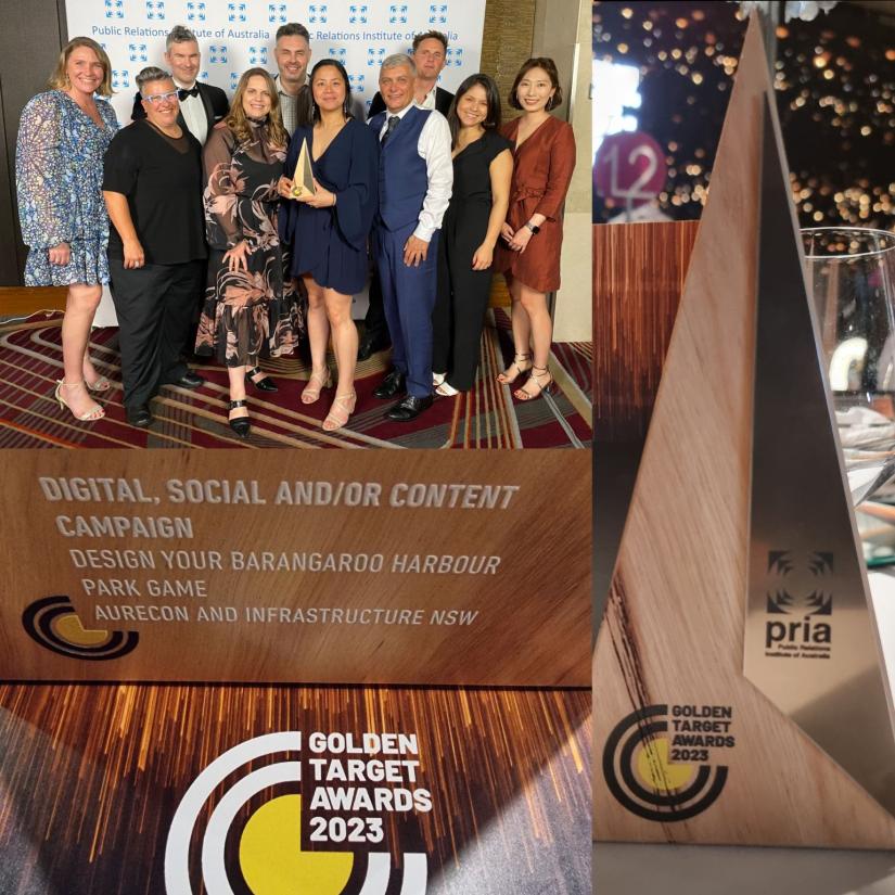 A group of people smile with their award