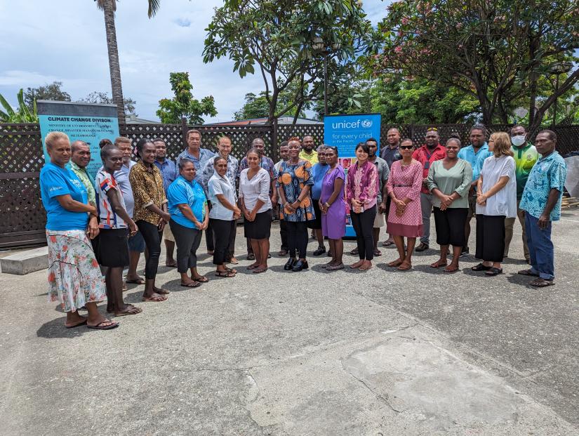 Group of people standing side by side