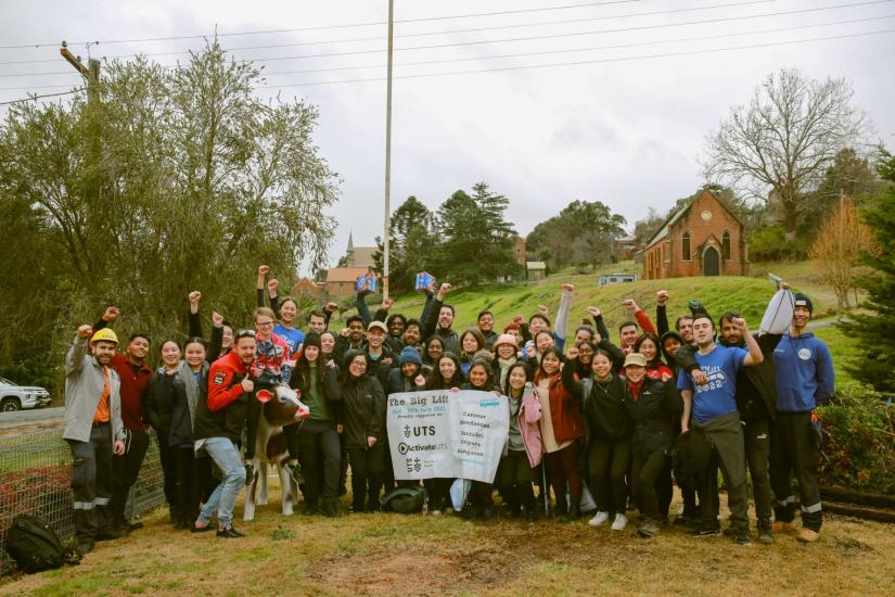 The Big Lift team poses for a group shot in a country town