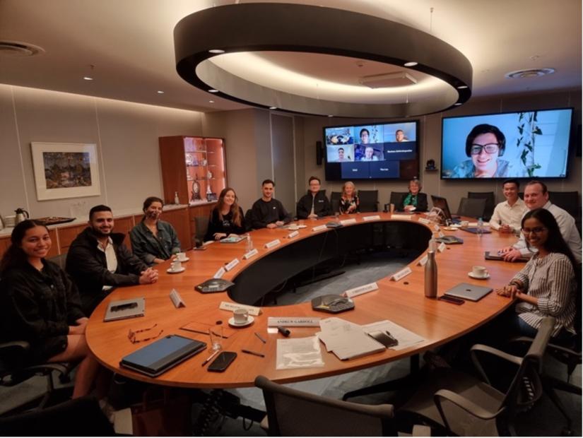 The academic board meets around a oval table