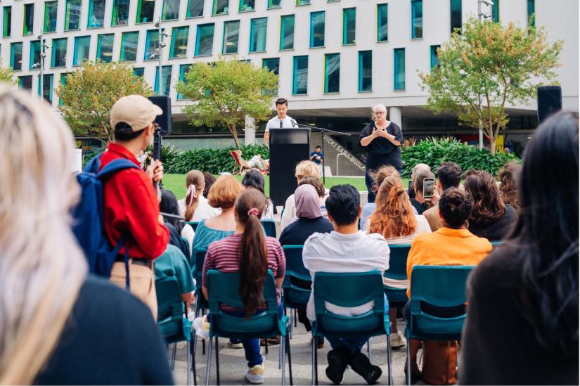 Kurt Cheng speaks at a podium