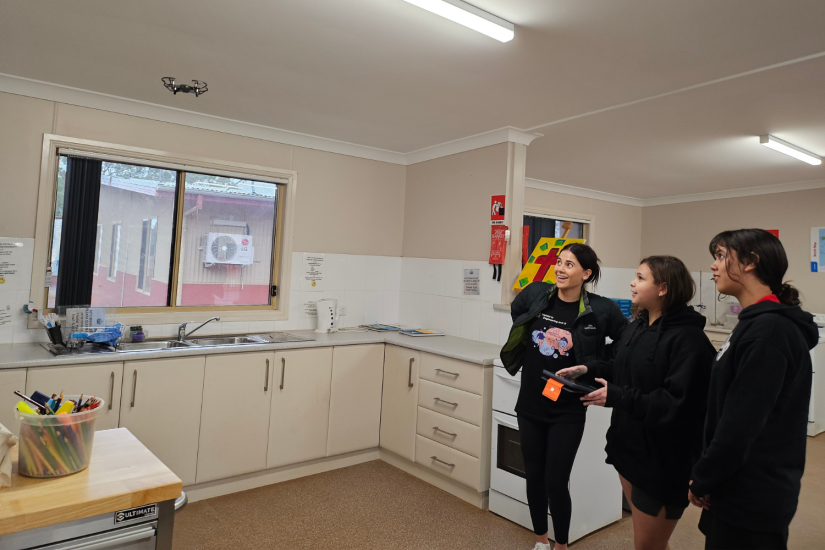 Students from Brewarrina Christina School setting their drone up to do a back flip.