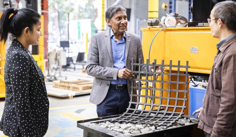 Photo of Buddhima Indraratna with rubber shock absorber.