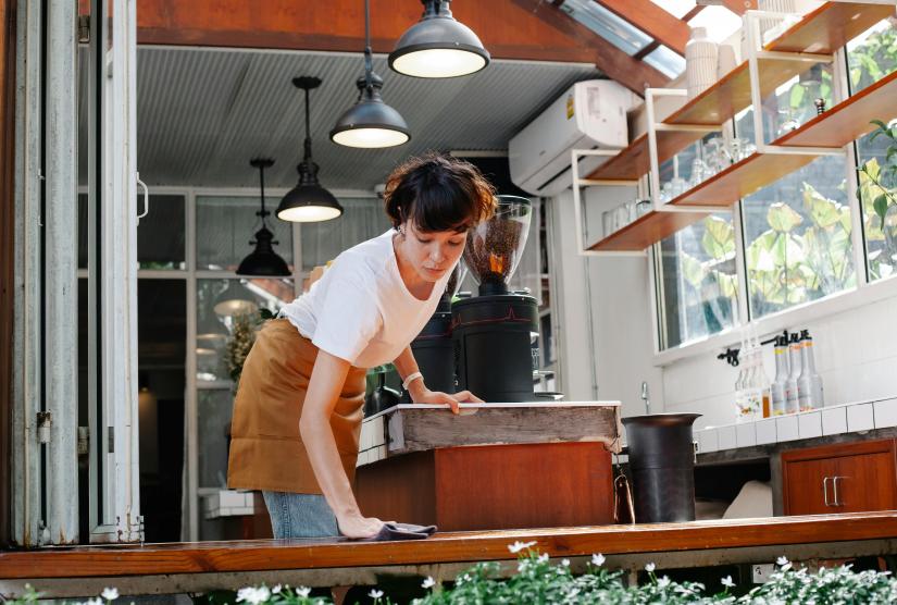 International student working in a cafe