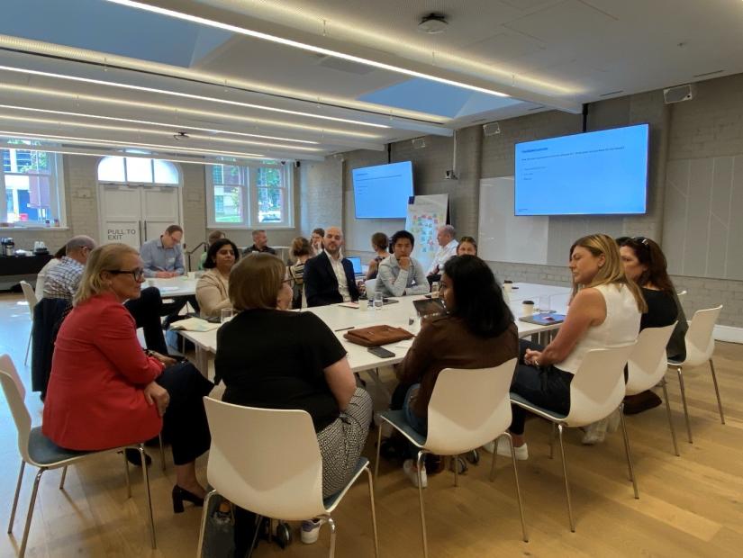 People sitting around a table at a workshop