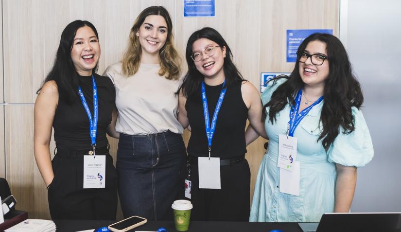 Group of people standing and smiling