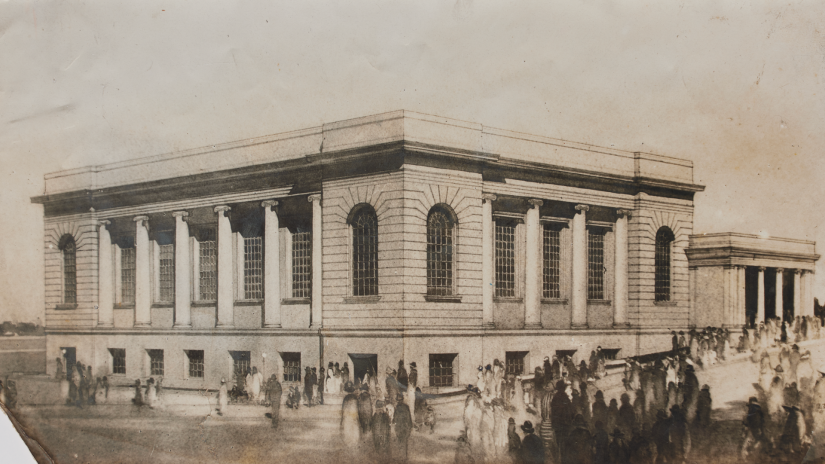 Old sepia toned photograph of building with horses and people in front of it.