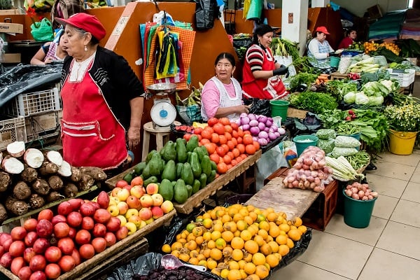 women selling fresh produce at a market