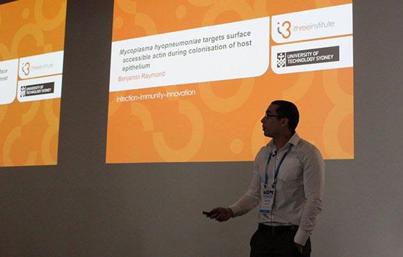 Benjamin Raymond presenting research