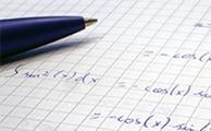 An exercise book with trigonometric equations written on the page