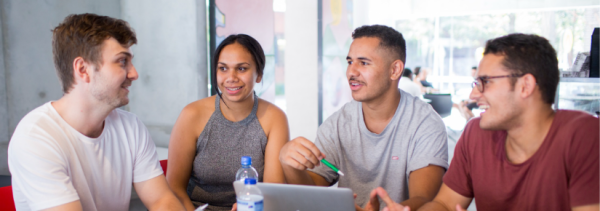 Four students conversing.