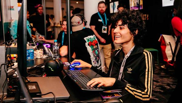 Person sits at a computer gaming during SXSW Sydney
