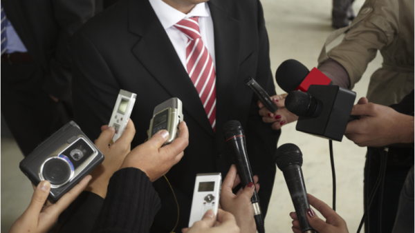 800x450%20close%20up%20of%20conference%20meeting%20with%20microphones